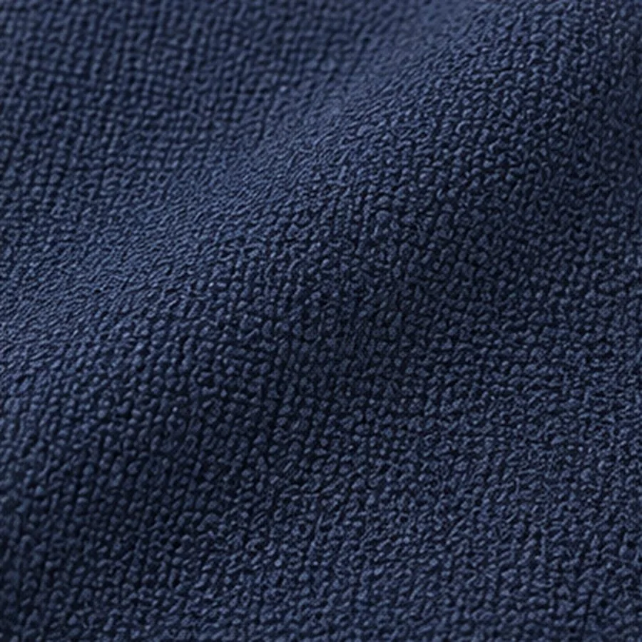 Navy moss crepe, a fine irregular pebble on a matte ground